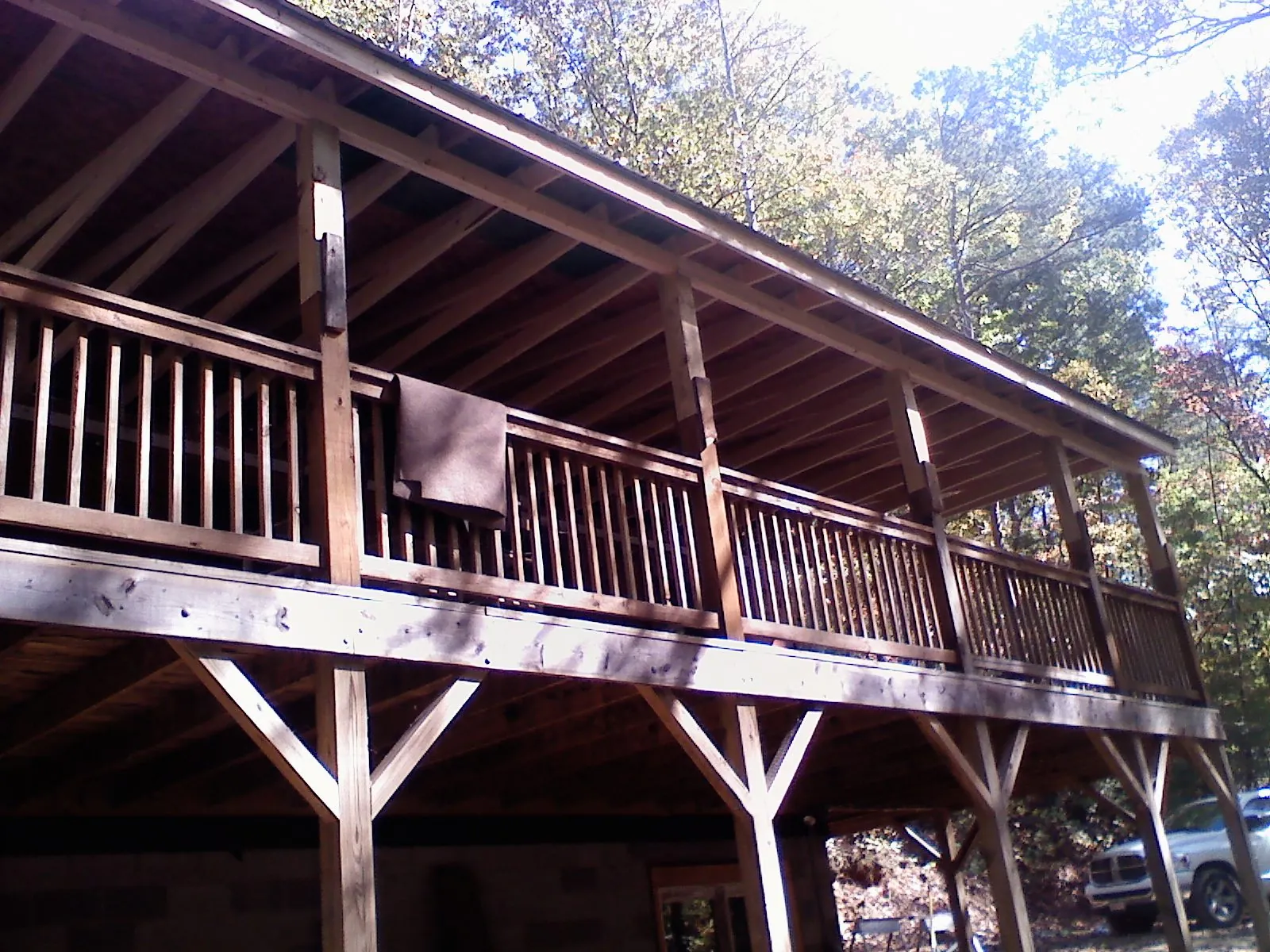 Timber framing under a new elevated porch and deck — Roof Leak Repair in Saline by Roofing Brothers